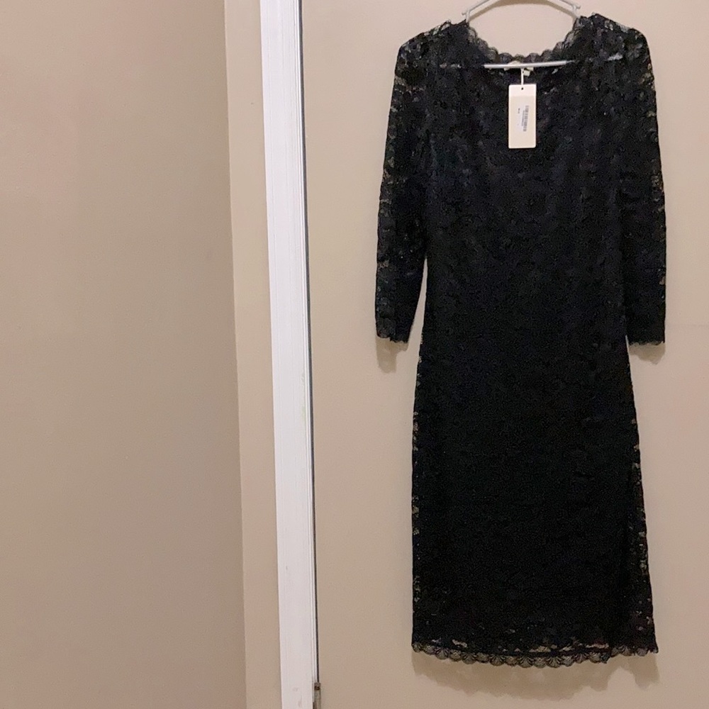 Black lace lined with Lace long sleeves dress. Beautiful and classy.